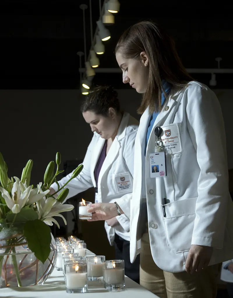 Two students in front of a cadaver memorial