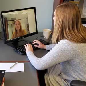 a UTHealth nurse providing Telehealth assistance to a patient