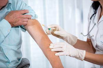 New research shows people who received at least one flu vaccination were less likely to get Alzheimer’s disease over the course of a lifetime. (Photo credit: Getty Images)