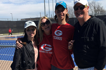 Photo of Luke Henley, third from left, with his family on the tennis court. (Photo courtesy of the Henley family)