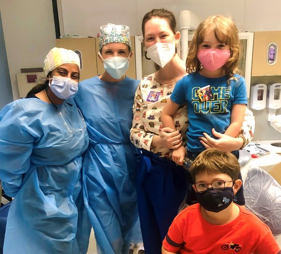 Group photo of Dr. Cameron Jeter (middle) with her daughter, Claire (middle right), and her son (Harrison) with Dr. Hillary Strassner (middle left) and Dr. Sarah Arafat.