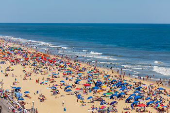 A photo of a crowded beach. Photo by Getty Images.
