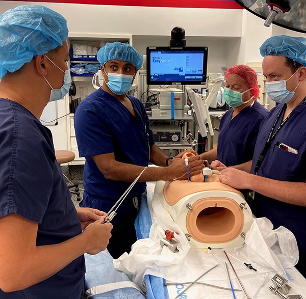 Photo of KuoJen Tsao, MD; Ramesha Papanna, MD, MPH; Stephen Fletcher, MD; and Clifton Brock, MD, practicing the fetoscopic surgery. (Photo credit: Ramesha Papanna, MD, MPH)