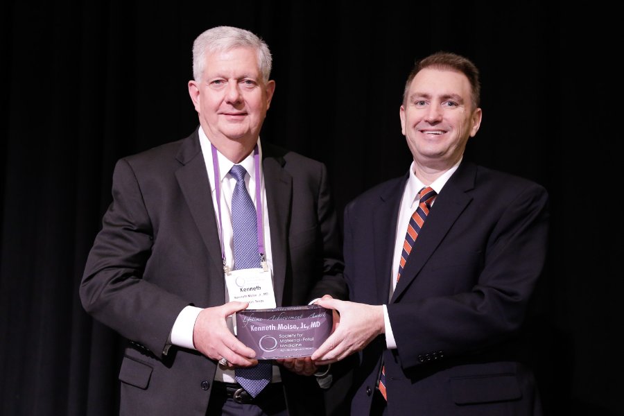 Photo of Sean C. Blackwell, MD, chair of the OB-GYN department at McGovern Medical School, presents the Lifetime Achievement Award to Kenneth Moise, MD, maternal-fetal medicine specialist. (Photo credit: Society for Maternal-Fetal Medicine)