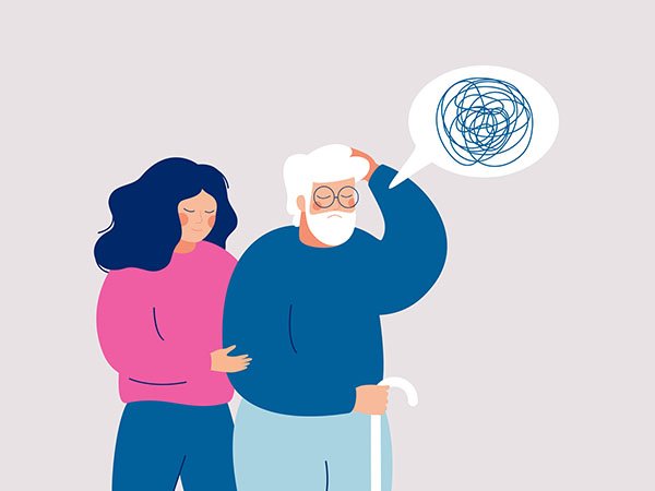 Image of a person with dementia with their caregiver. (Photo courtesy of Getty Images)