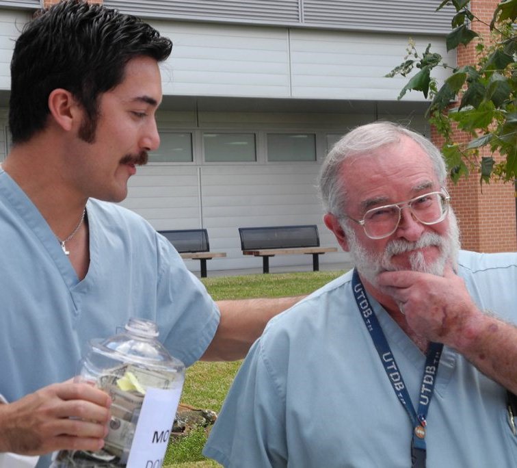 Professor Gary Frey, DDS (right), will sacrifice his beard to the Movember fundraising event organized by dental students like Bryce Gates (left).