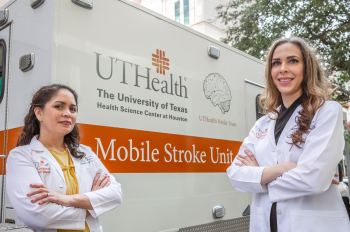 Photo of Amanda L. Jagolino-Cole, MD,  and Alexandra Czap, MD in front of the UTHealth mobile stroke unit. (Photo credit: J. Daniel Escareño/UTHealth)
