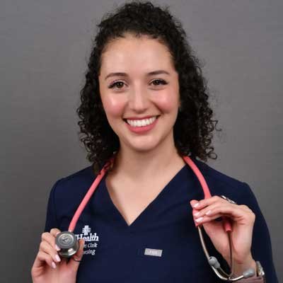 Photo of Paula Castro with a stethoscope