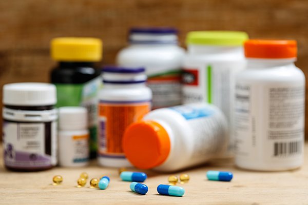Photo of medication bottles and pills (Photo courtesy of Getty Images)