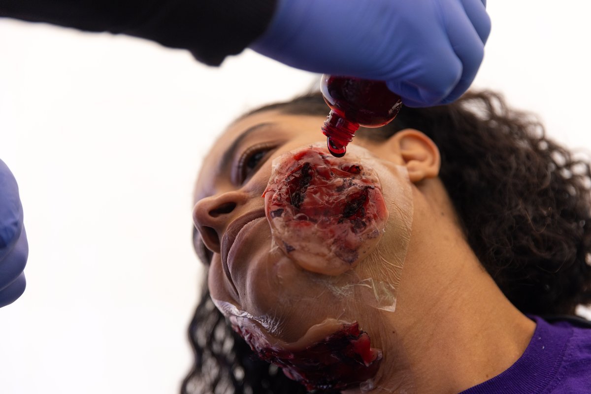 One student, assigned as a victim, gets a moulage makeover ahead of the staged mass casualty incident. (Photo by Rogelio Castro/UTHealth Houston)