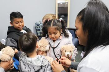 Young children visited the teddy bear clinic at UTHealth Houston Cares and took home their newest stuffed friend. (Photo by Kacie Fromhart, UT Physicians)
