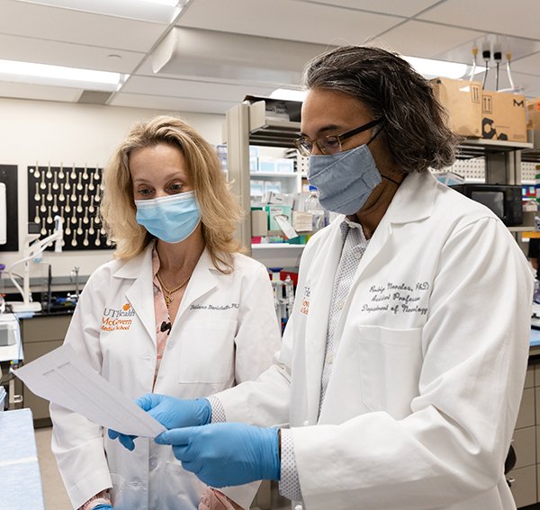 Photo of Tatiana Barichello, PhD and Rodrigo Morales, PhD. They are researching the role of peripheral and brain infections in the development of Alzheimer's disease with a grant from the National Institutes of Health. (Photo by Rogelio Castro/UTHealth)