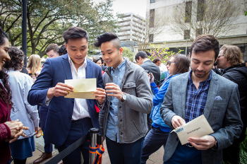Students from the 2019 Match Day ceremony open their envelopes to see where they will spend their residency. Photo by UTHealth Houston