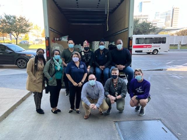 Members of UCSC Stand in front of their donation truck