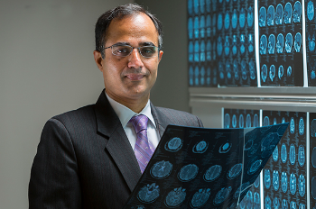 Photo of Nitin Tandon, MD, who identified a crucial region in the temporal lobe which appears to act as the brain’s visual dictionary. (Photo by James LaCombe)
