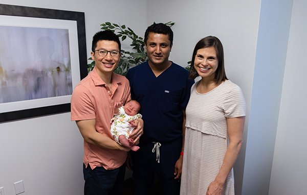 Photo of Dr. Ramesha Papanna, MD, with the Briggs-Cheng family. (Photo by UTHealth Houston)