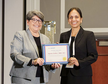 Sujatha Sridhar (right), MBBS, MCE, receives the AAHRPP 2023 Lifetime Achievement Award. (Courtesy photo)