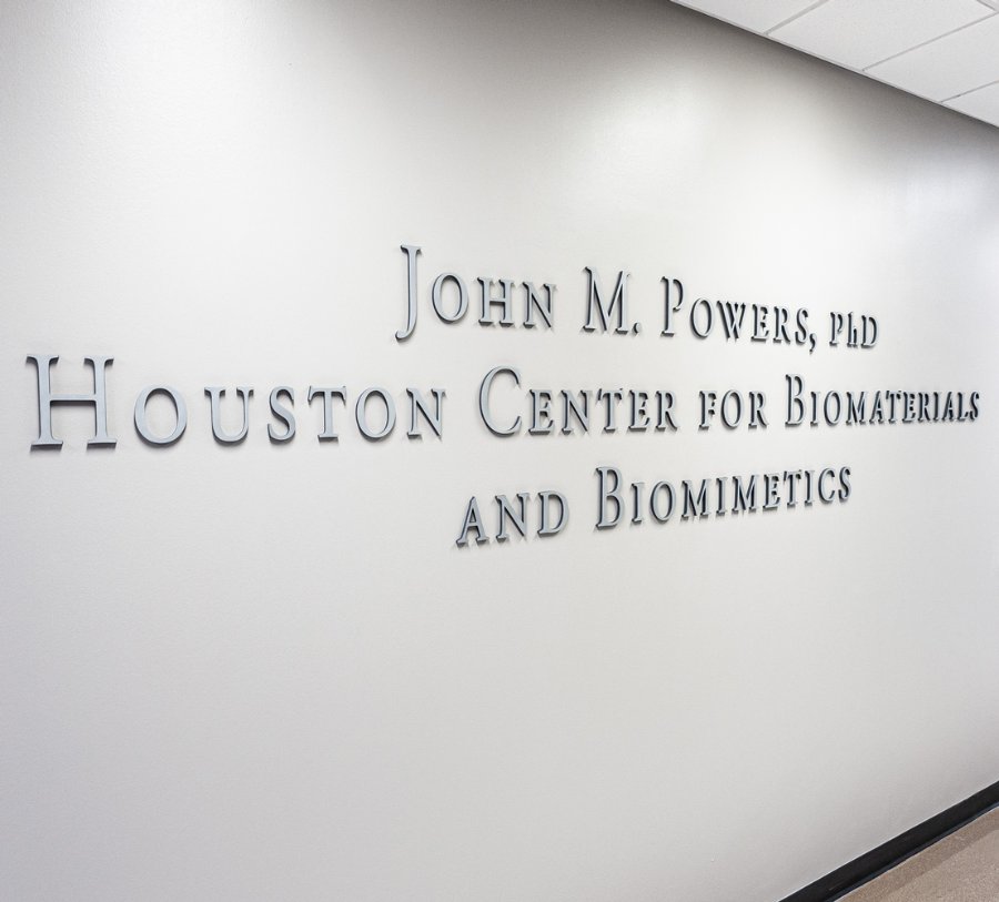 Lettering on wall displays the name for the John. M. Powers, PhD, Houston Center for Biomaterials and Biomimetics.