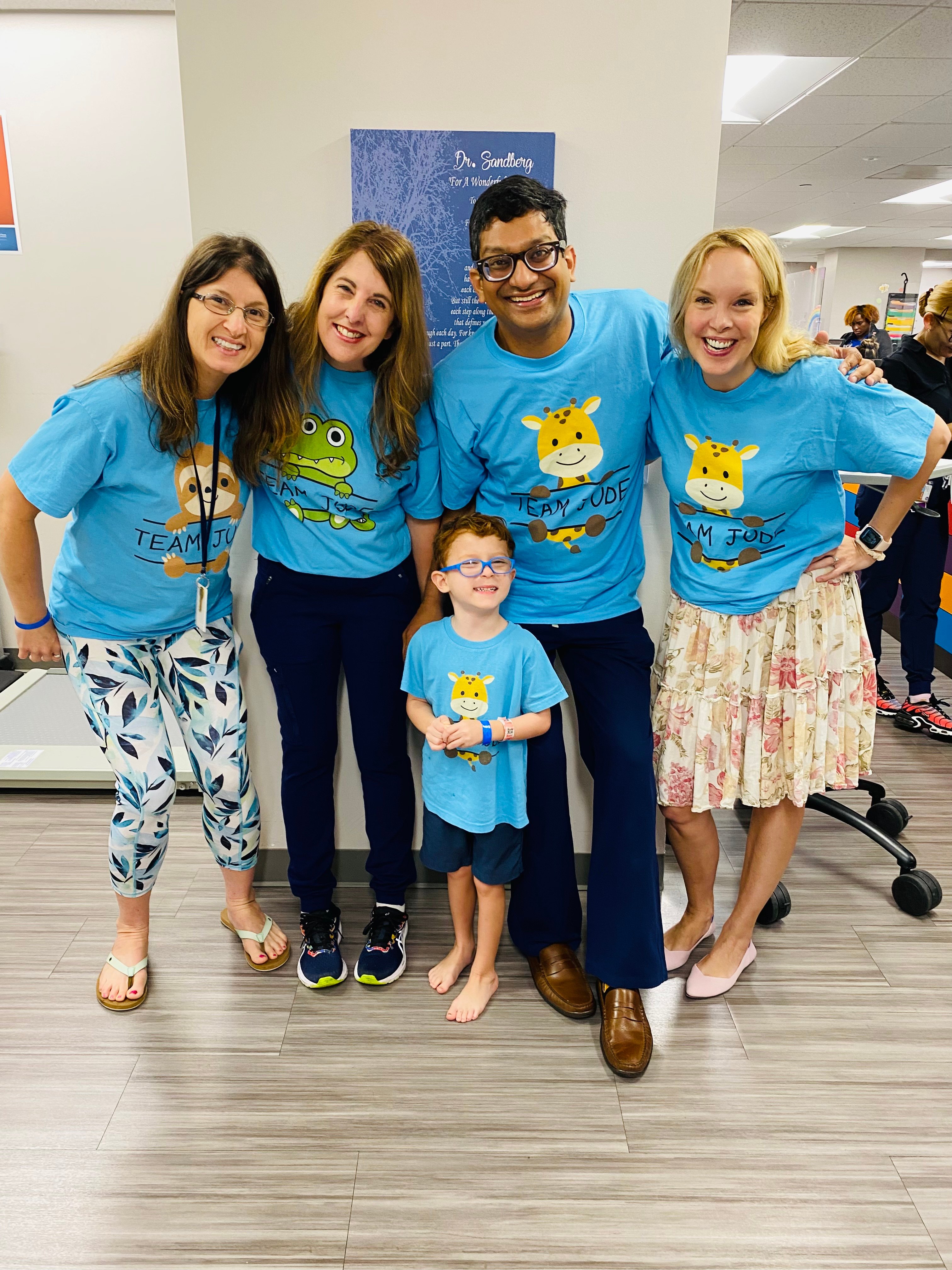 Jude's mom, Jeanne Jackson, left, with Christy Hill, Manish N. Shah, MD, and Stacey Hall, DO, at the Texas Comprehensive Spasticity Center. (Photo by UT Physicians)