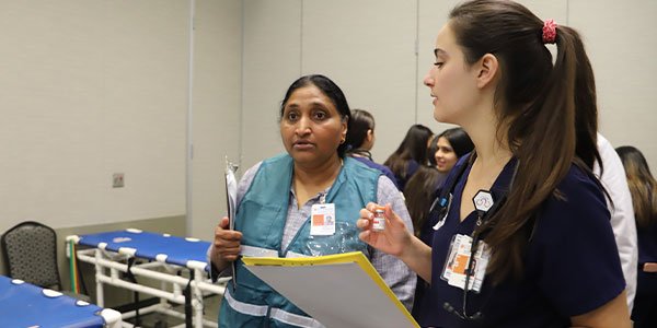 A UTHealth Houston student coordinates triage of mock patients in the simulated emergency room. (Photo by UTHealth Houston)