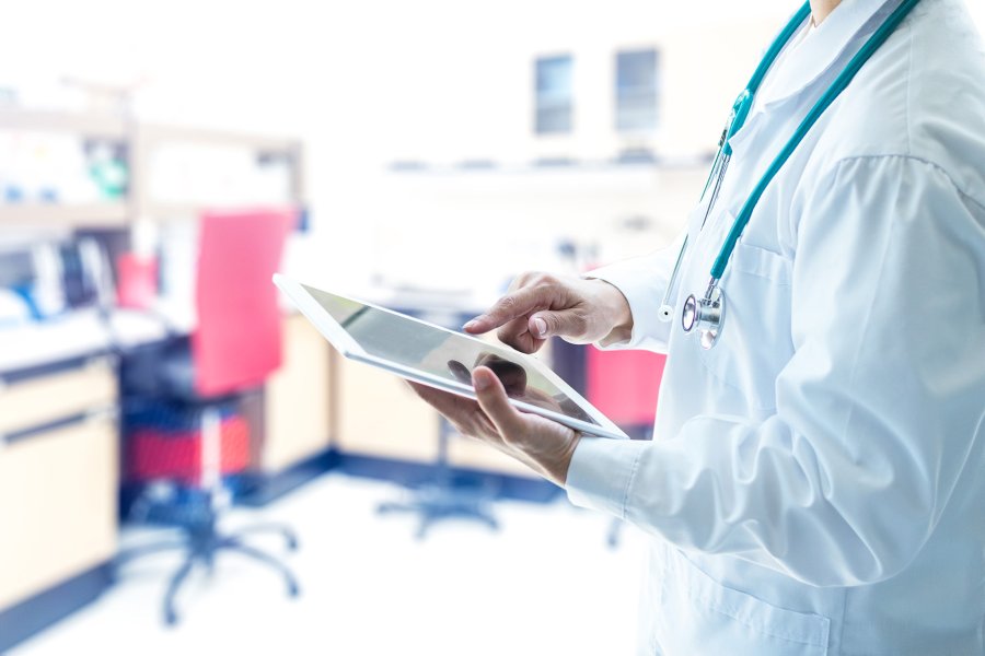 Photo of doctor holding a tablet (Photo courtesy of Getty Images)