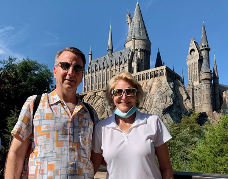 Despite a primary progressive multiple sclerosis diagnosis, Kristi Taylor, pictured with her husband Glenn, was still able to travel to Universal Studios in Florida. (Photo courtesy of Kristi Taylor)