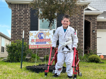 Mickey Wright stands tall and strong outside his home. (Photo by Andi Atkinson/UT Physicians)