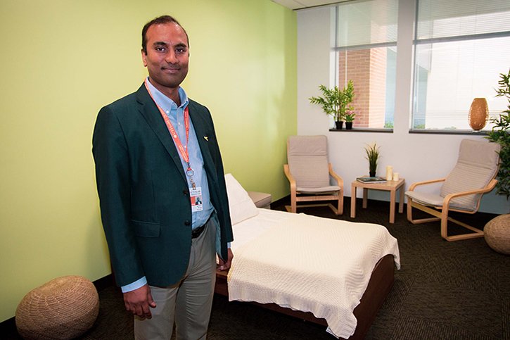 Sudhakar Selvaraj, MD, PhD, stands in a specially designed, home-like, treatment room that will be used for the trial.