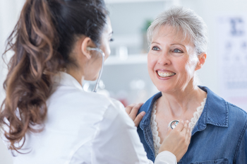 Older woman being examined by physician