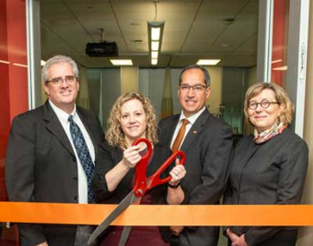 Photo of Diane Santa Maria, dean ad interim, and there other UTHealth leaders cutting the ribbon on the new simulation center at Cizik School of Nursing at UTHealth