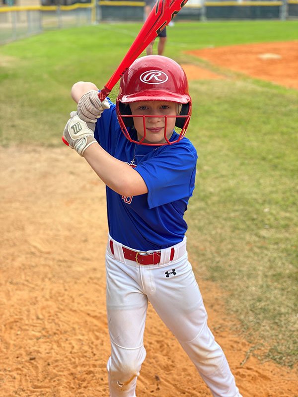 Photo of Charlie Crawmer in his baseball uniform. Photo courtesy of Sarah Crawmer.