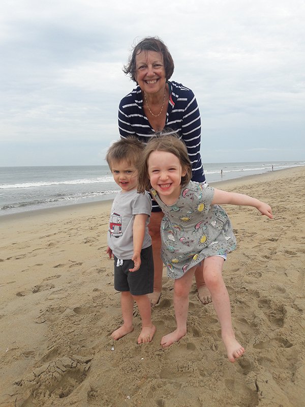 Catherine Troisi, PhD, poses for a photo with her grandchildren taken during their last family vacation in 2019 in Virginia Beach, Virginia. Troisi is looking forward to visiting again this summer. (Photo courtesy of Catherine Troisi, PhD).