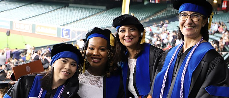 Four PhD graduates at the 2021 commencement ceremony.