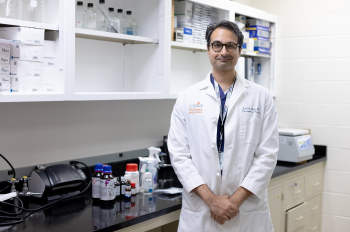 Sunil A. Sheth, MD, associate professor in the Department of Neurology with McGovern Medical School at UTHealth Houston, in his lab. (Photo by Rogelio Castro/UTHealth Houston)