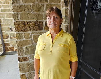 More than two years after her spinal fusion surgery, Ruth Bischoff, 69, stands tall at her home in October 2023. (Photo provided by Ruth Bischoff)