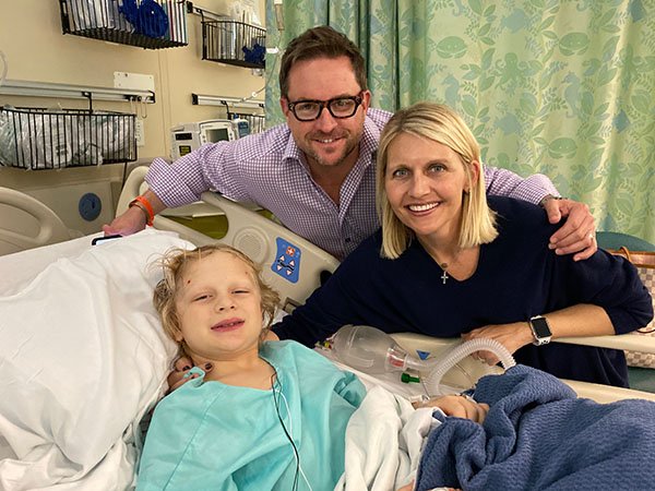 Picture of Charlie Crawmer with parents, Brian and Sarah Crawmer, following his laser ablation surgery. Photo courtesy of Sarah Crawmer.