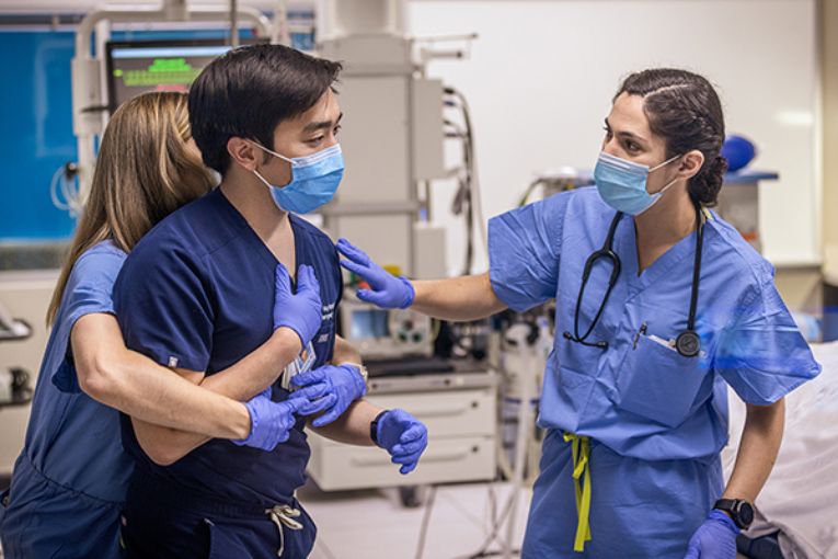 Huy Hoang, MD, emergency medicine resident with UTHealth Houston Emergency Department, trains SpaceX Polaris Dawn mission's medical officer Anna Menon (left) and mission specialist Sarah Gillis (right) in lifesaving techniques. (Photo by UTHealth Houston)