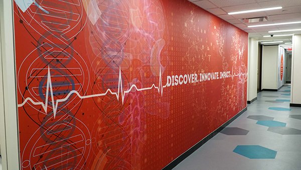 Photo of red wall at UTHealth School of Biomedical Informatics.