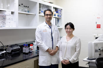 Study authors Sunil A. Sheth, MD, with McGovern Medical School at UTHealth Houston, and Youngran Kim, PhD, with UTHealth Houston School of Public Health, in the lab. (Photo by Rogelio Castro/UTHealth Houston)