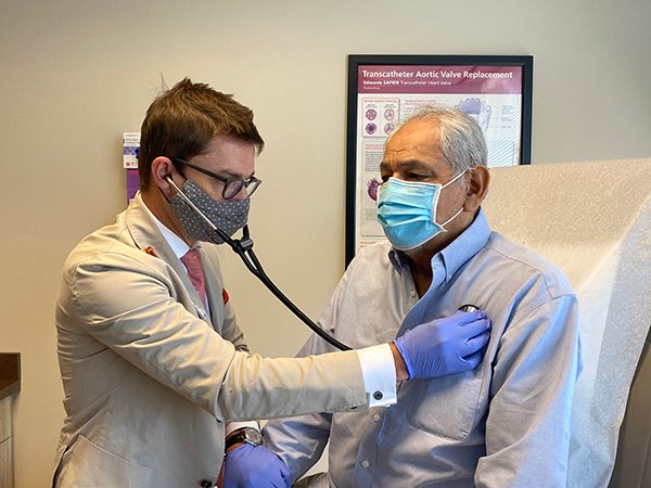 Gustavo Oderich, MD, FACS, checks Rodolfo Sandoval’s heartbeat at his six-week post operation checkup. Oderich repaired Sandoval’s complex aortic aneurysm with a minimally invasive procedure. (Photo by: Caliann Ferguson/UTHealth)