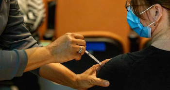 Up-close photo of a woman getting a COVID-19 vaccine shot.(Photo by UTHealth)