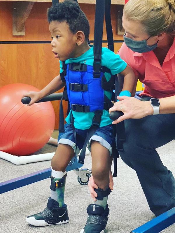 Aries, who began walking on his own at 4 years old, still regularly attends physical rehabilitation. (Photo provided by Aisha Atkinson)