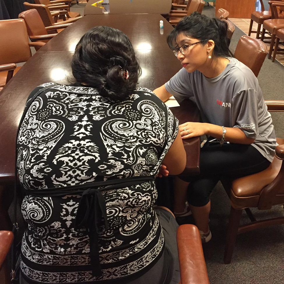 BSN student Jocelyn Yanez, who served as a research assistant to Dr. Daphne Hernandez, interviews an immigrant parent. (Photo courtesy Hernandez.)