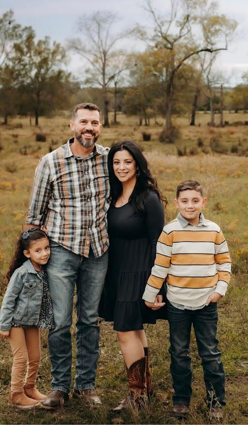 Alison stands with her parents, Chuck and Shelly, and brother, Chase, for a family portrait. (Photo provided by Shelly Casey)