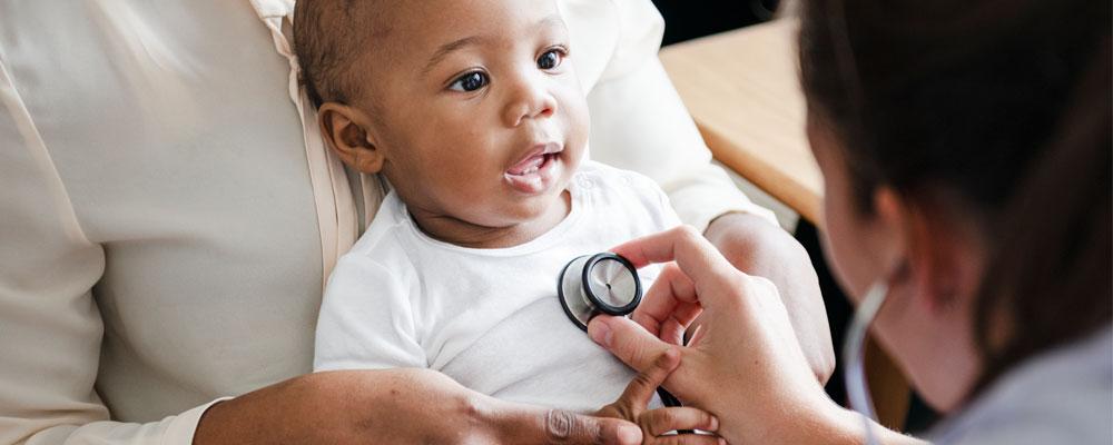 Image of a health care worker using a stethoscope with a pediatric patient