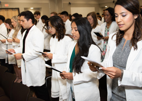 School of Dentistry students receiving white coats
