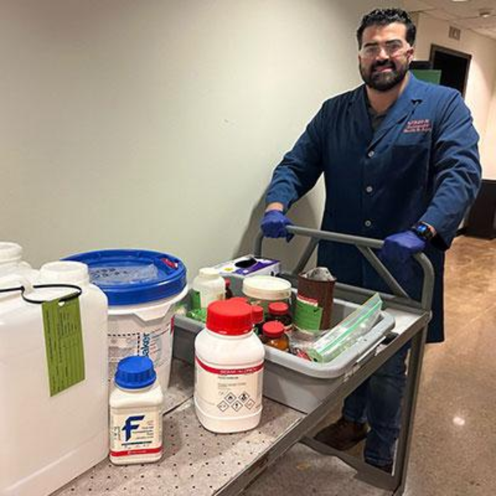 Felipe Munoz, safety specialist for the Environmental Protection Program, carries out hazardous waste. (Photo provided by Alan Lucas/UTHealth Houston)