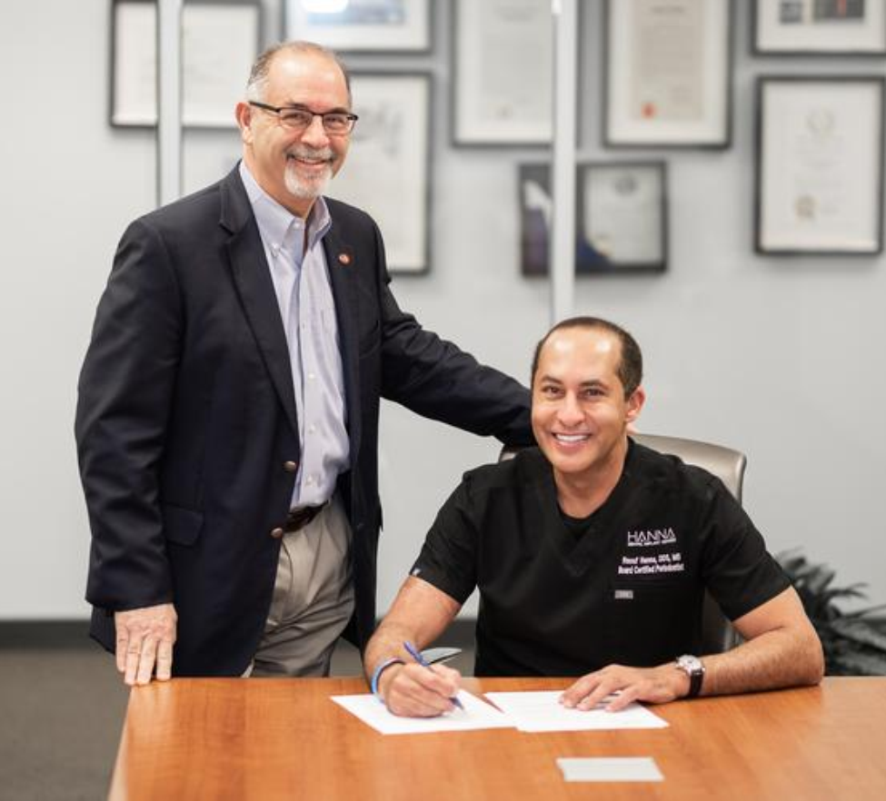 Dr. Raouf J. Hanna (right), pictured with Dean John A. Valenza, DDS, signs an endowment agreement with UTHealth Houston School of Dentistry.