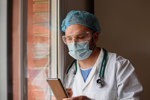 Photo of healthcare working texting. (Photo by Getty Images)
