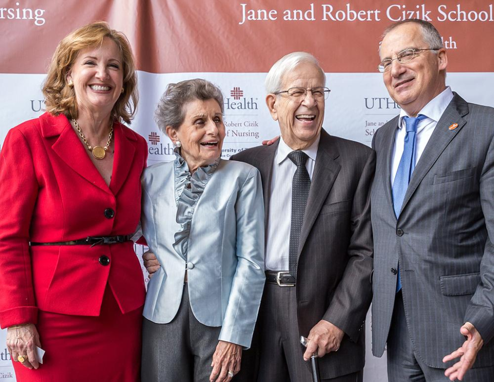 Dean Lorraine Frazier (left) and UTHealth Houston President Giuseppe N. Colasurdo, MD (right) share a laugh with the Ciziks at the naming ceremony.
